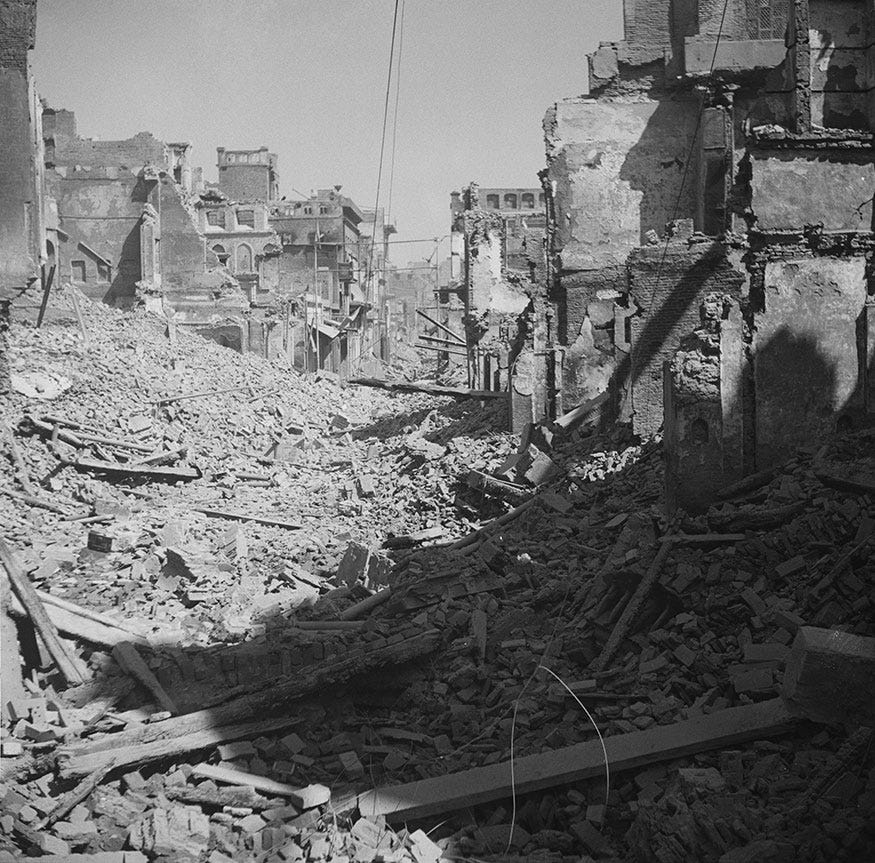 Burned-out and ruined buildings in the Katra Jaimal Singh area of Amritsar after communal violence in the city during the Partition of British India, Punjab, March 1947.