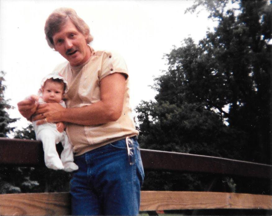 One of the few photos of my father and I when I was a baby. My mom took this photo of us at a local park in Indiana