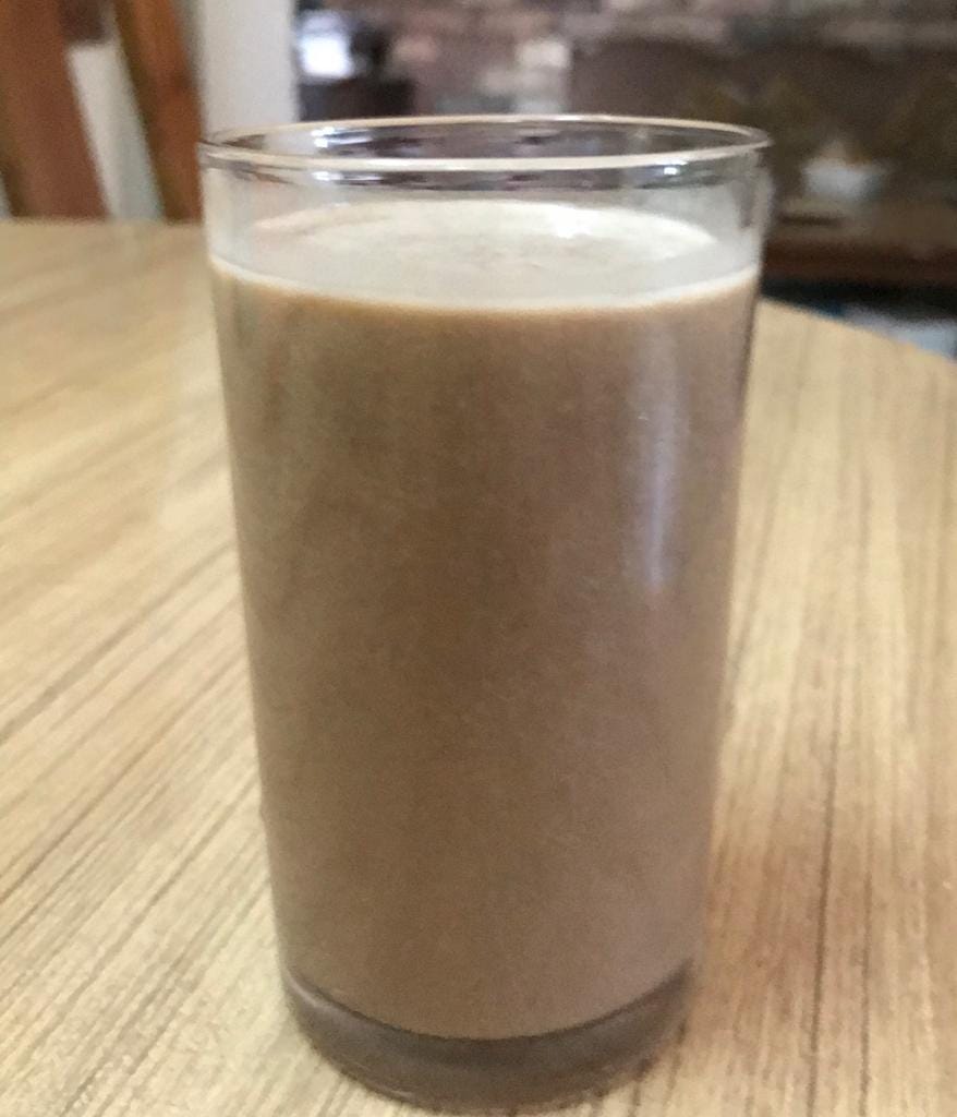 Banana smoothie made out of banana (offcourse), protein powder, curd and honey with a some coffee.