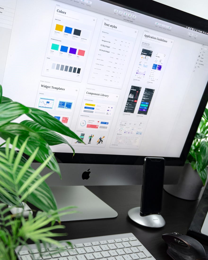 A designer's computer screen, including color palette. Design can help grow your brand tremendously. 