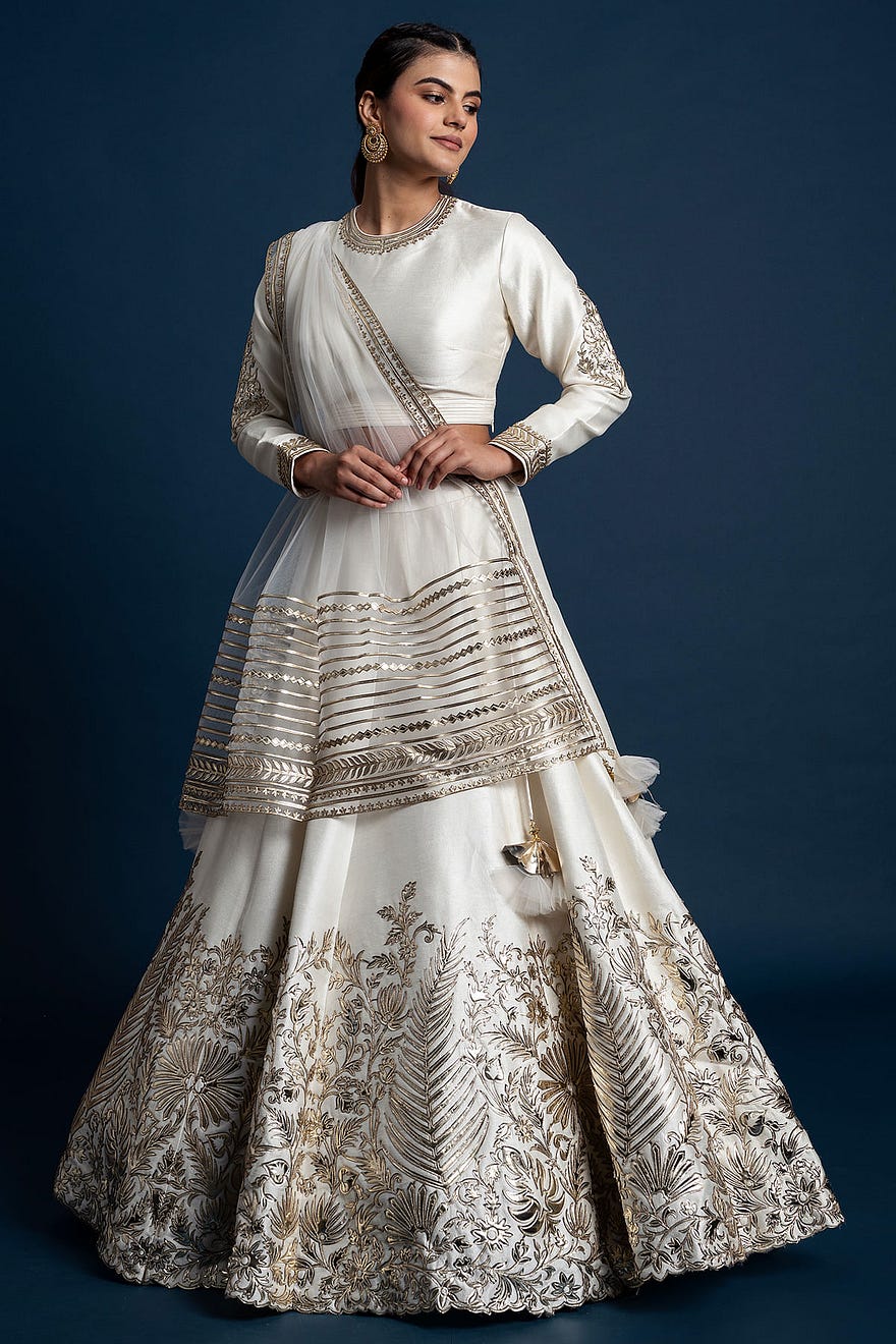 Off-White Metallic Embroidered Raw Silk Engagement Lehenga Online at Samyakk