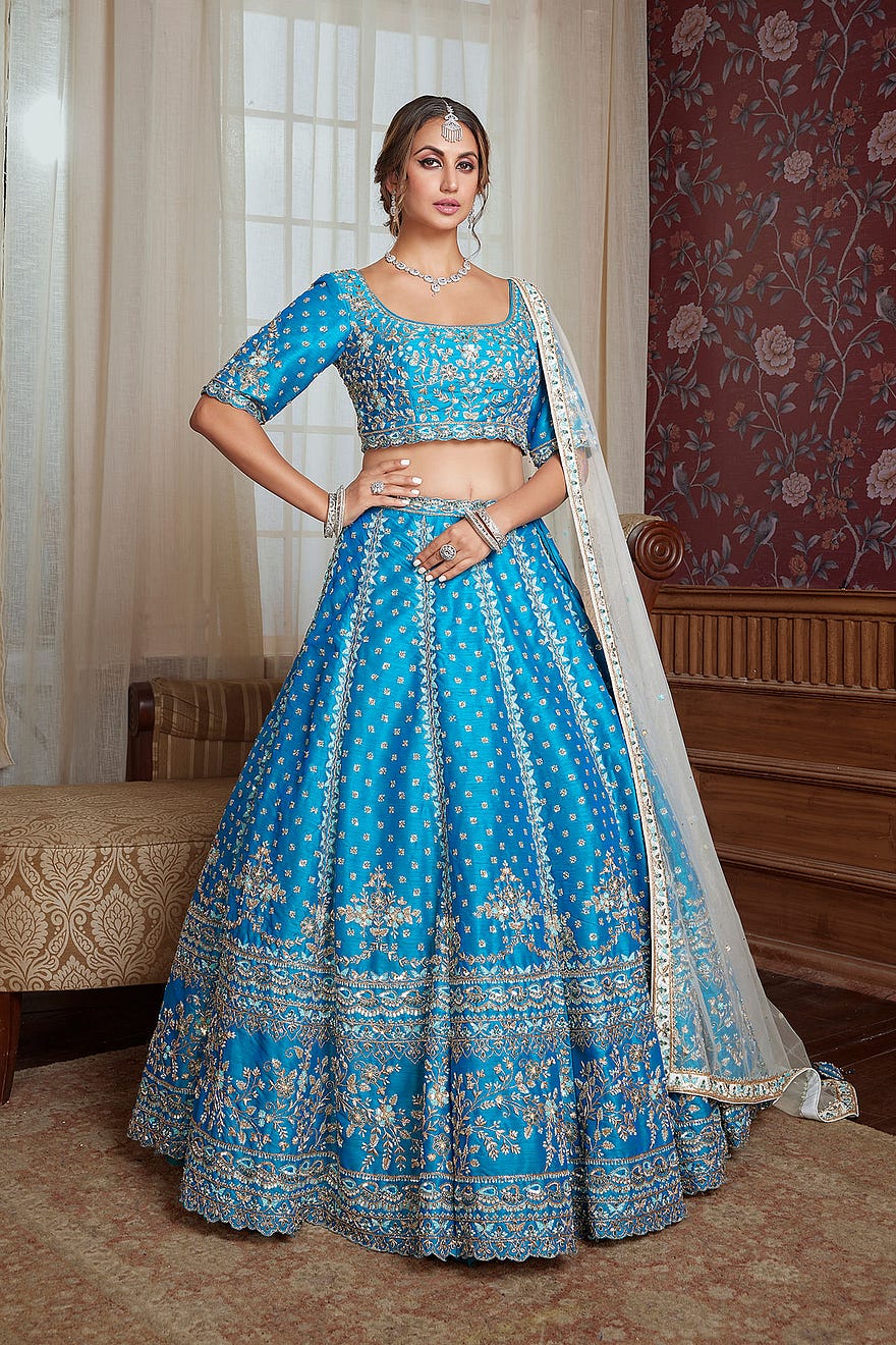 Firozi Blue Umbrella Style Raw Silk Engagement Lehenga With Embroidered Squarish Round Neck Blouse Online at Samyakk