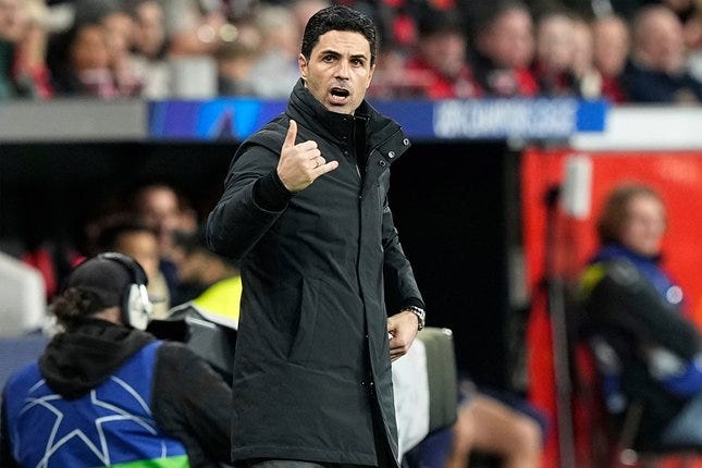 SBOxITUGOL — Pelatih Arsenal, Mikel Arteta memberikan instruksi kepada para pemainnya di laga melawan Bayer Leverkusen pada leg 1 babak 16 besar Liga Champions, 12 Maret 2026. © AP Photo/Martin Meissner