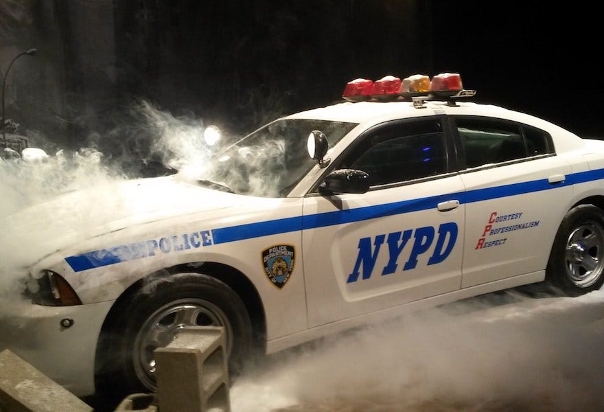 A picture of a crashed NYPD car from a Division Press Event