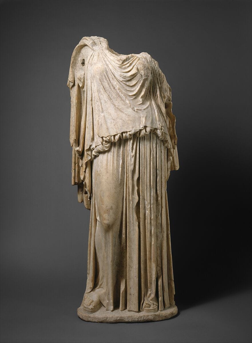 A bronze Greek statue of the Doric Peplos is on display.