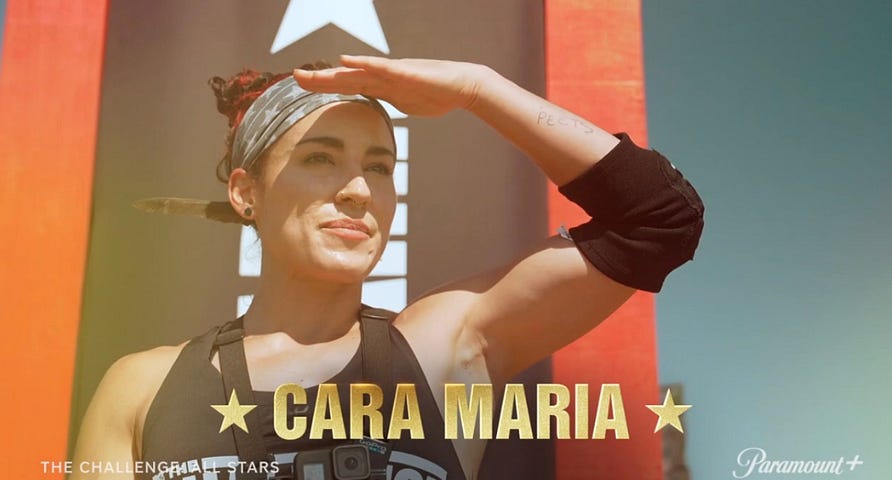 Cara Maria Sorbello salutes with determination, showcasing her competitive spirit during The Challenge: All Stars 4. The image captures her strength and resilience, highlighting her iconic status in the reality TV competition.
