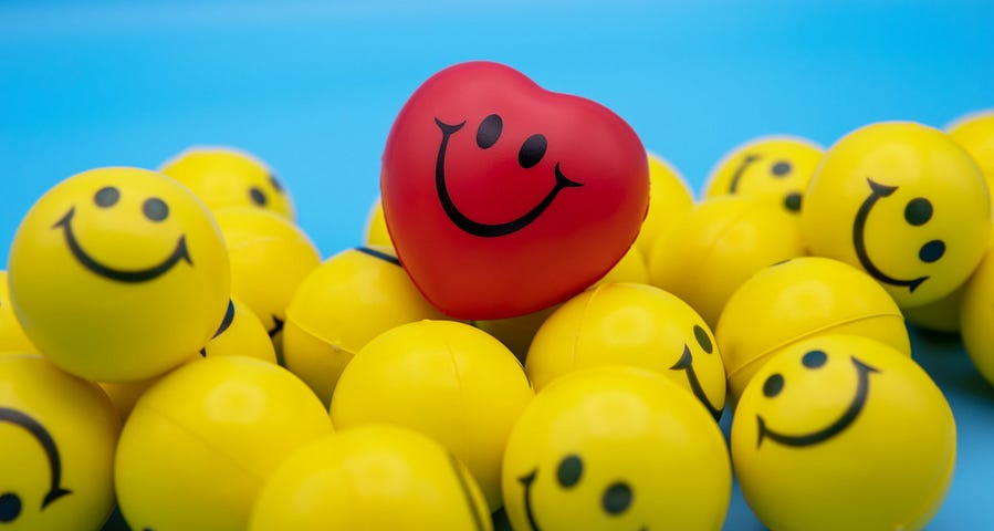 Yellow and red smiley balloons