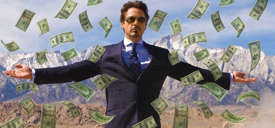 Image of Robert Downey Jr with his arms wide and money flying all around