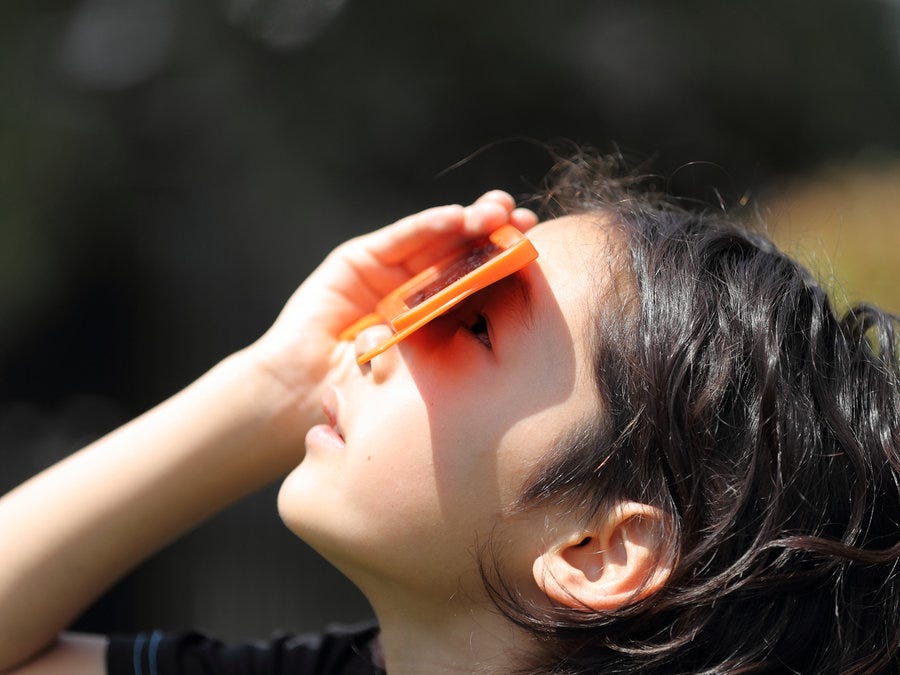 girl viewing eclipse