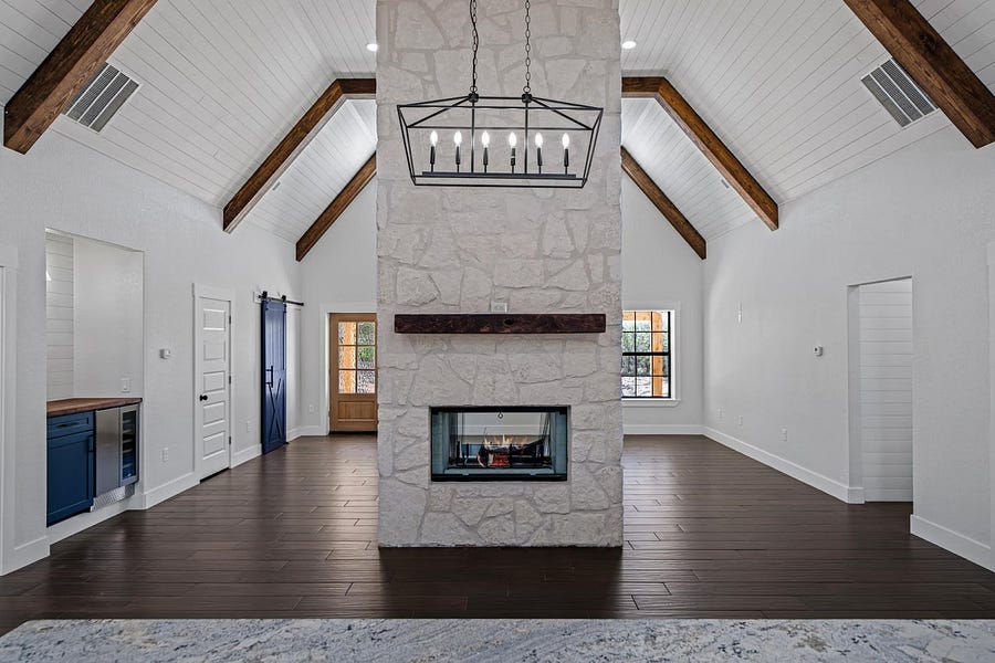 Texas Barndominium by Kristina Richie - Double-sided fireplace