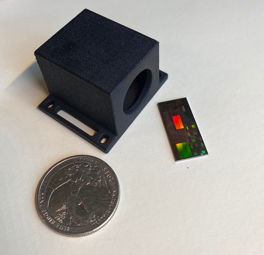 Voyant housing prototype next to early LiDAR test chip.