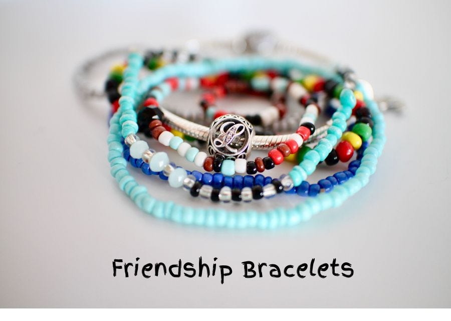 picture of a pile of colorful friendship bracelets made by children