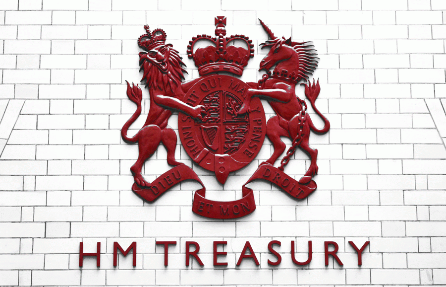 Red HM Treasury sign against a white tiled wall.