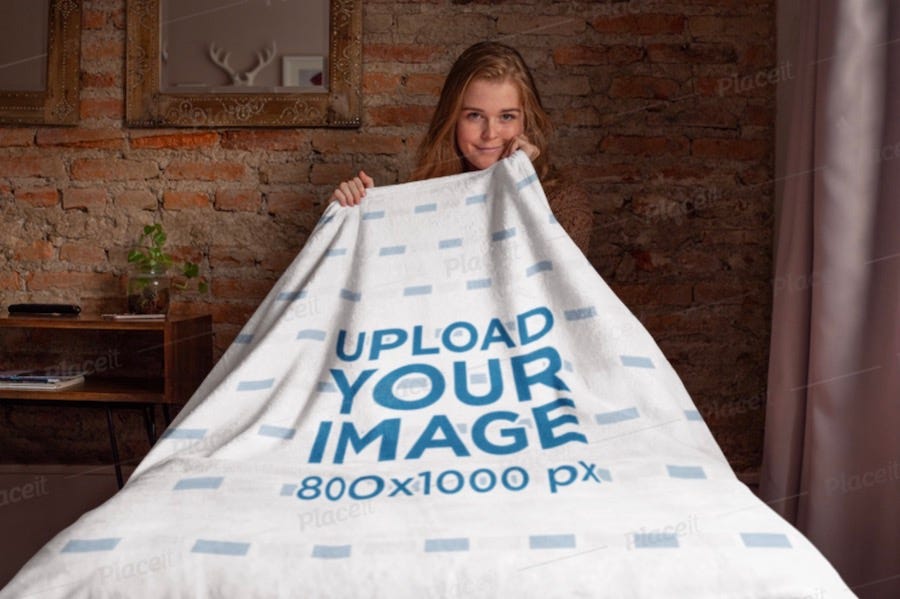 blanket mockup featuring a girl sitting on a bed
