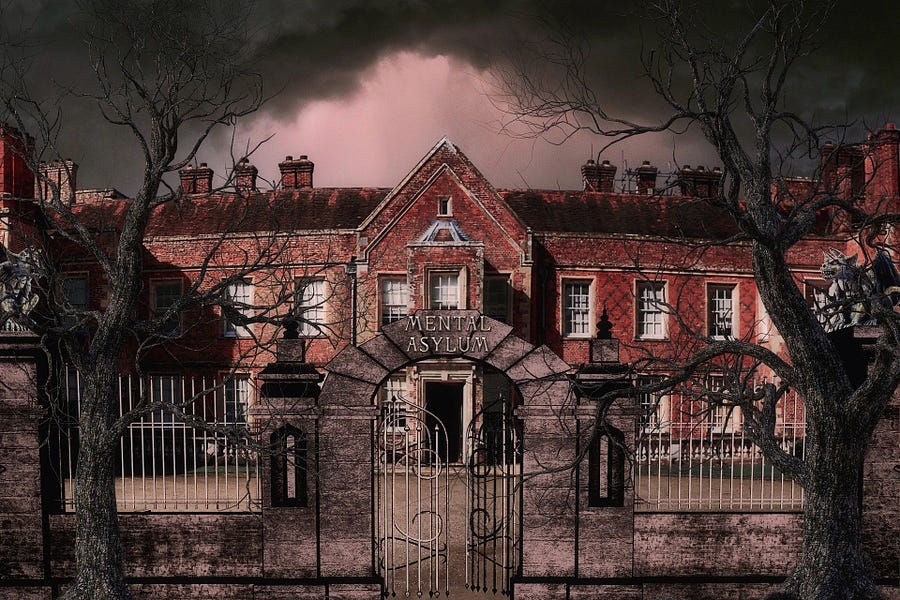 Front of an insane asylum, red-bricked with turrets and chimneys and fenced in, under a darkened sky