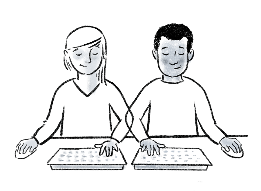 Two people sit side by side, completing the same task on two screens and mirroring each other’s actions as they go along.