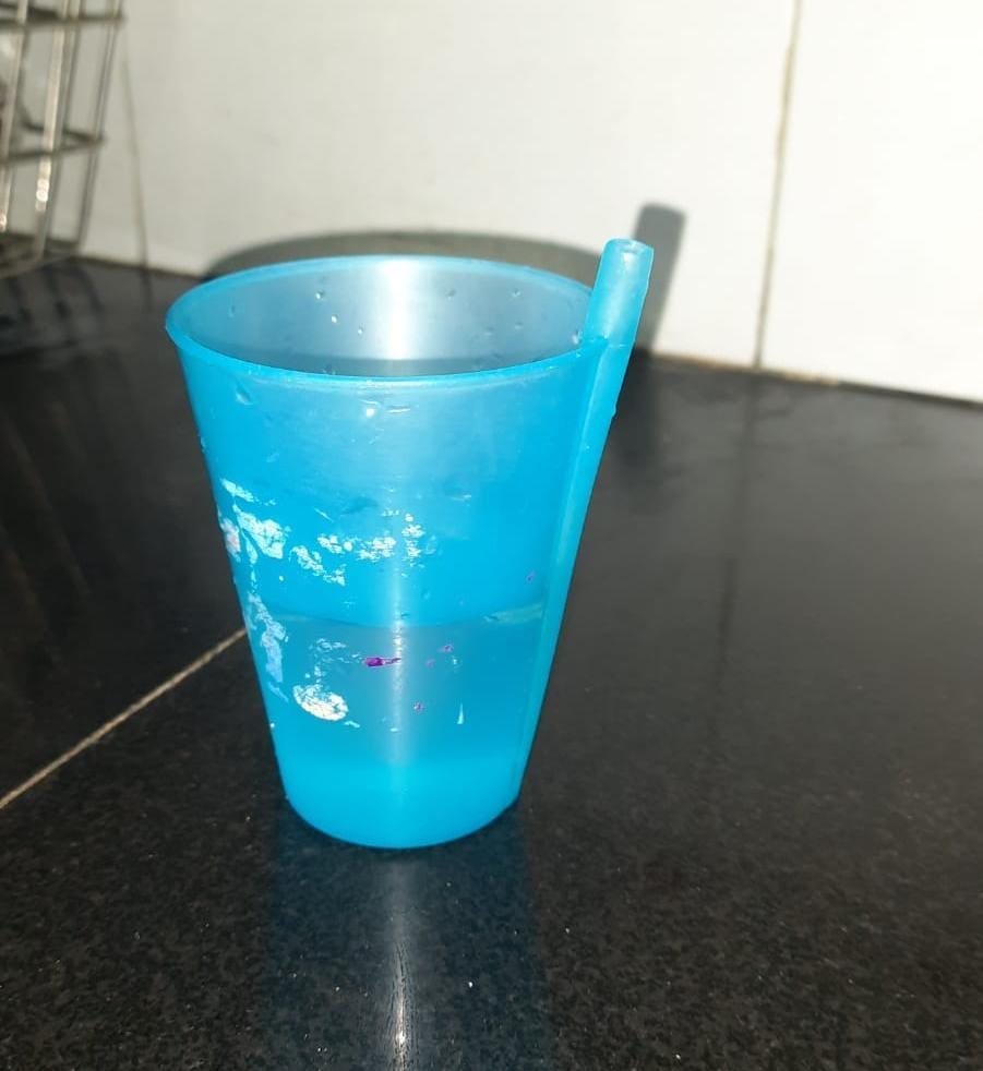 a plastic glass for kids with a inbuilt straw.