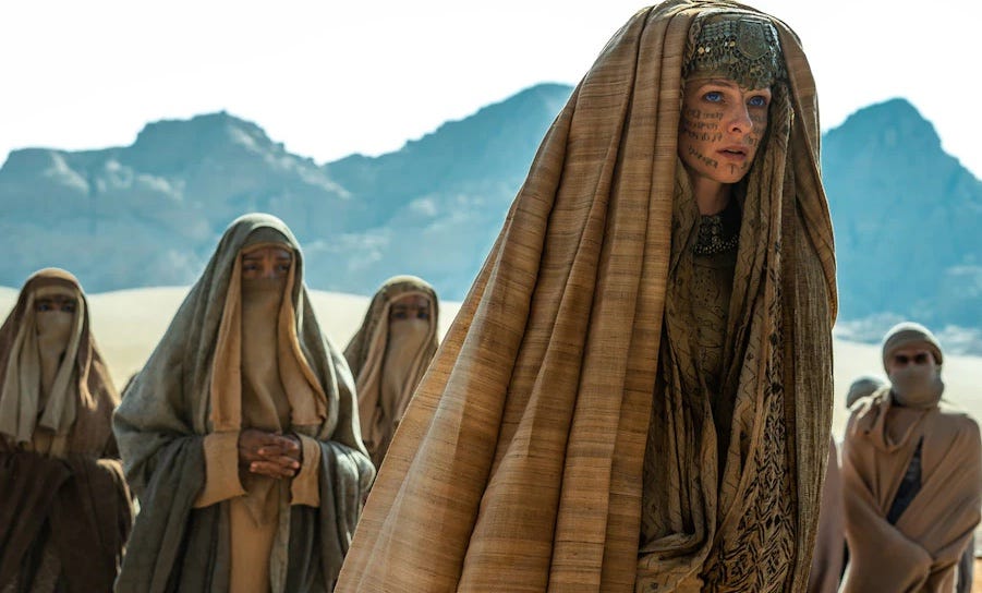 Jessica in her Reverend Mother garb flanked by other Fremen