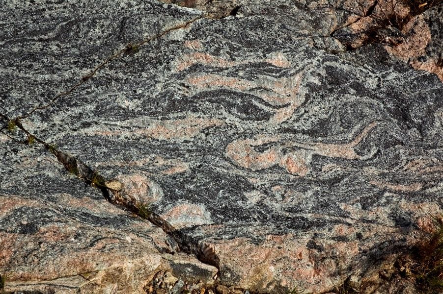 The quartz crystals swirling through acasta gneiss have been dated at 4 billion years old.