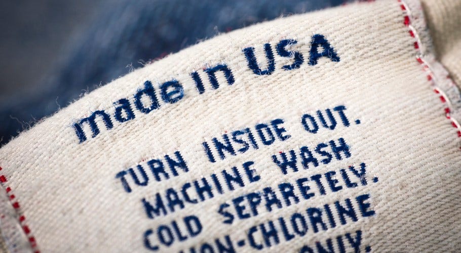 T-shirt with a tag indicating the clothing was made in the USA