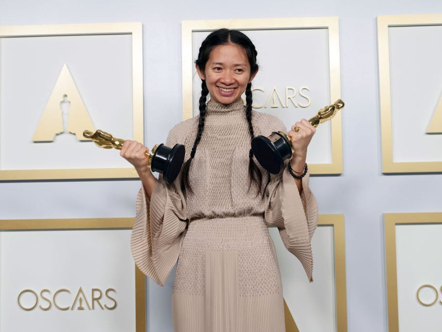Chloé Zhao, winner of the best director for “Nomadland,” poses with her Oscars.