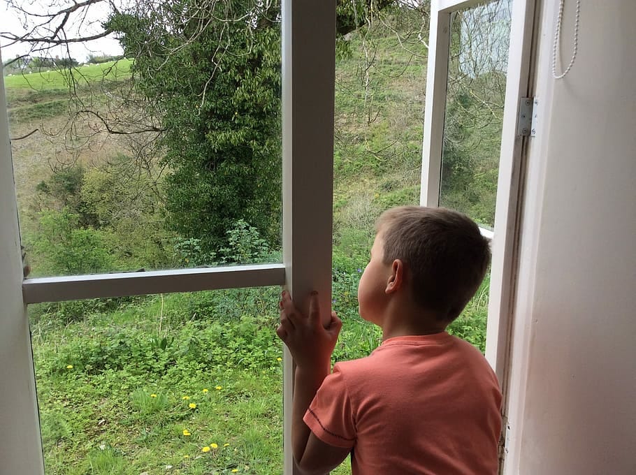 Child looking out window