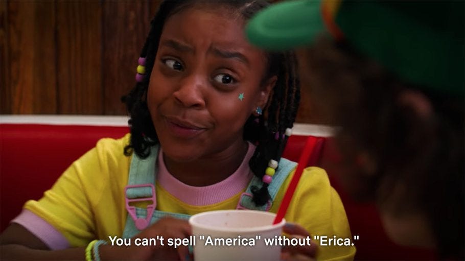 Erica gives a skeptical smile with the caption “You can’t spell ‘America without Erica”