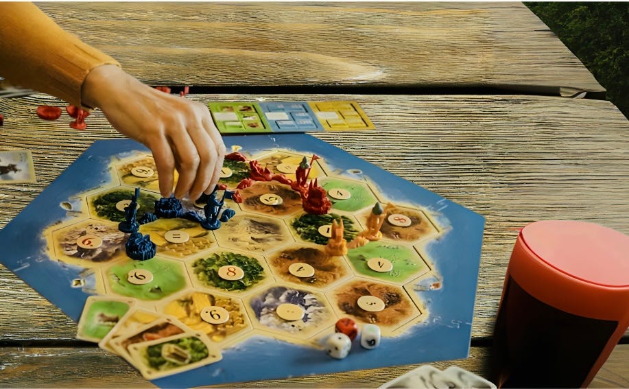 A person playing Catan