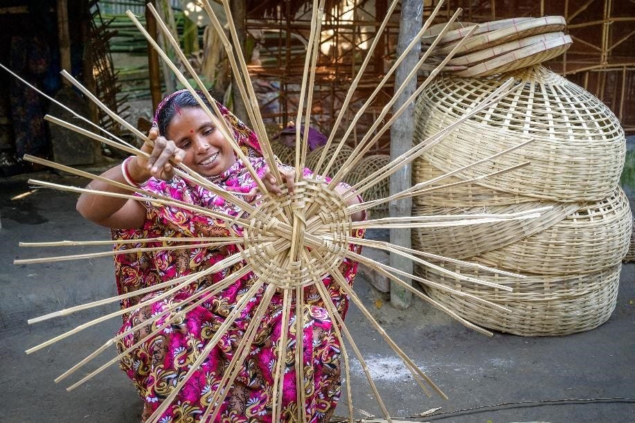A Nobo Jatra participant weaving baskets.