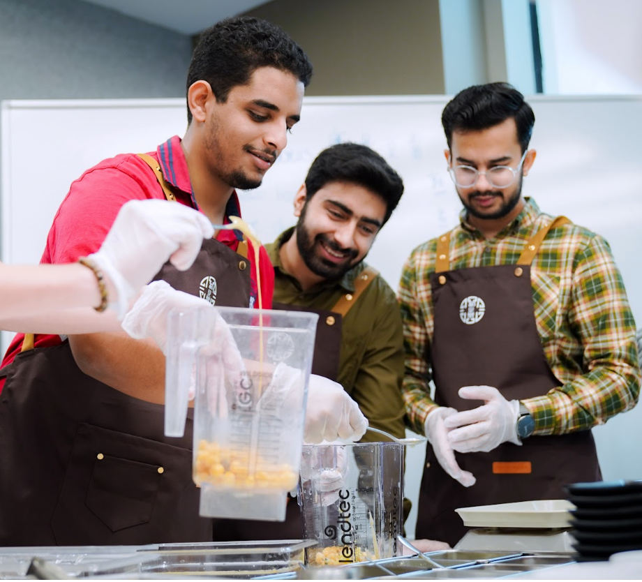 Students making hummus in groups