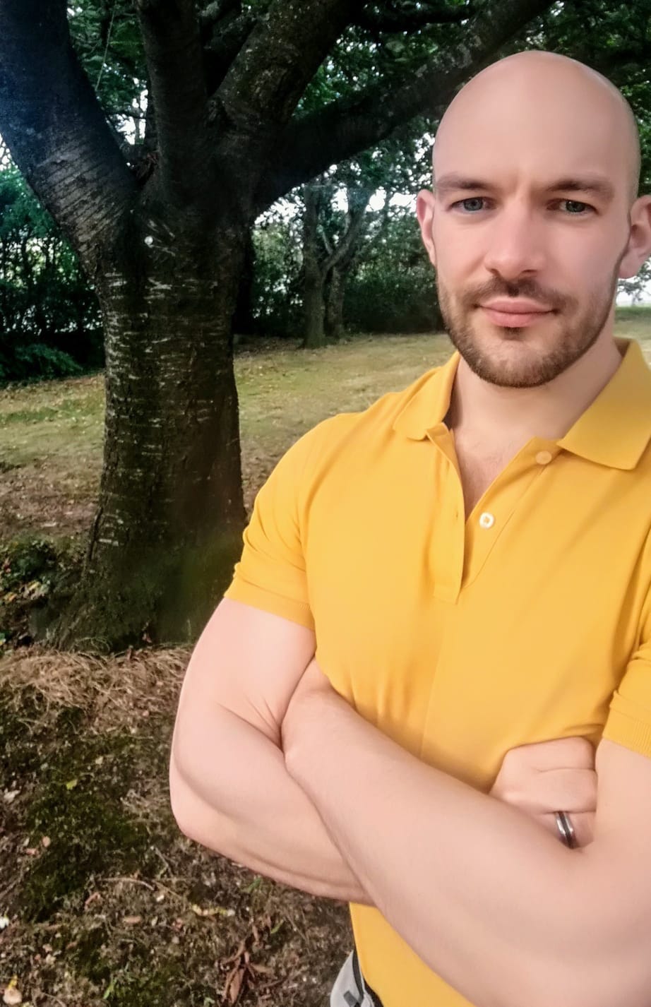 Phil Tyreman standing in a park in front of a tree.