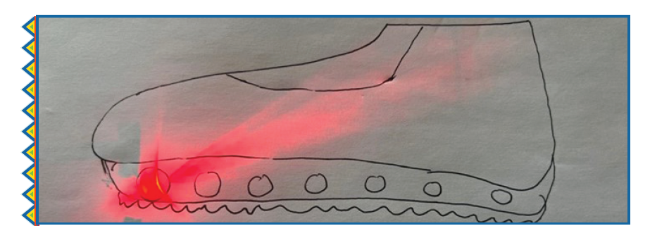 A drawing of a shoe prototype in pen with a flash of red at the bottom.