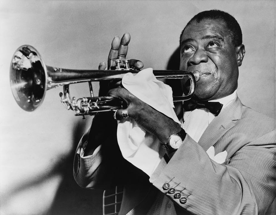 A man blowing a trumpet
