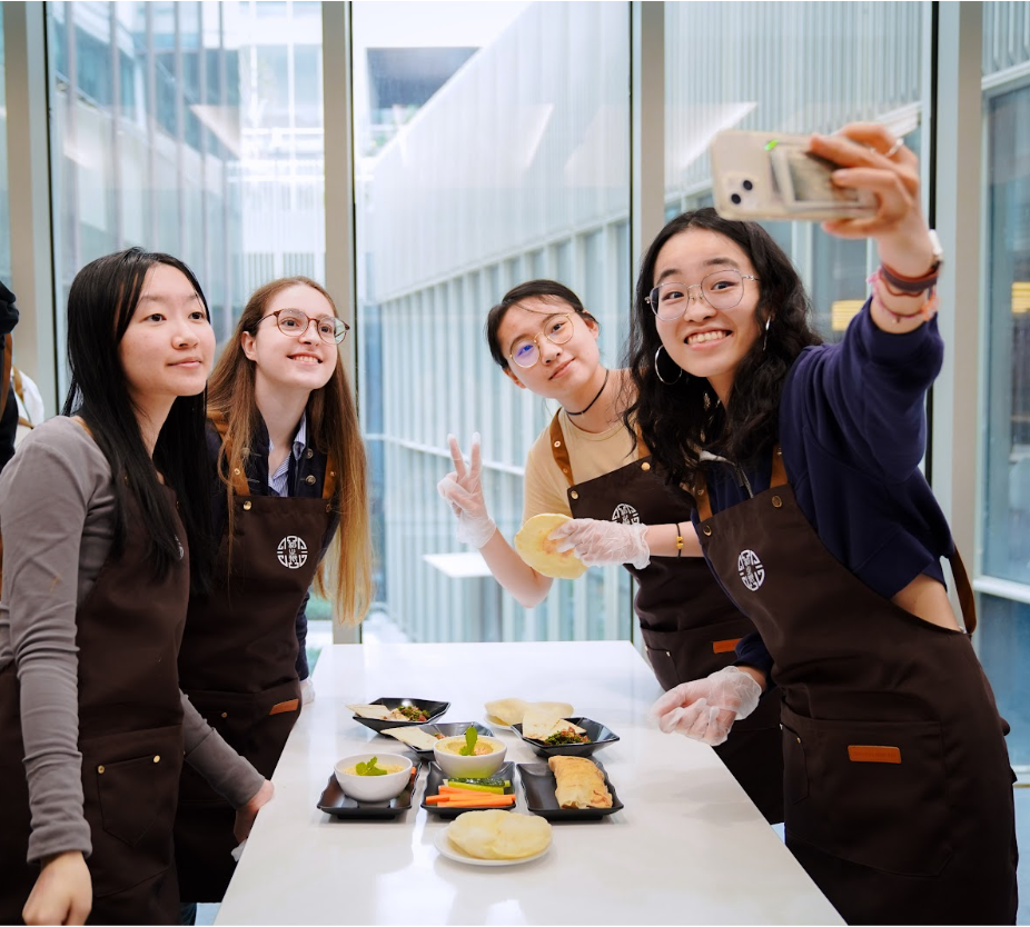 Students taking selfies after making and tasting their own self-made hummus