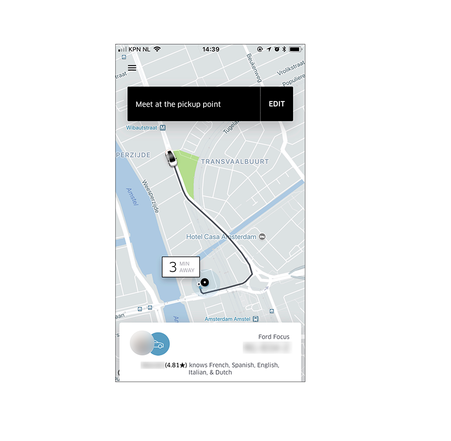 Uber’s pick-up screen with a map, driver and car info, and ETA