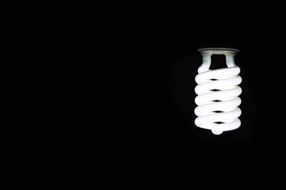 A white LED lightbulb shining in a black background