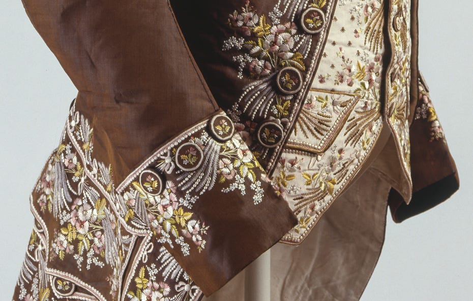 Iridescent silk coat from the 1770s with embroidered floral motifs embroidered in white and canary yellow fleurettes.