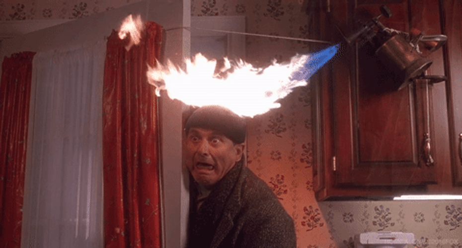 A scene from home alone one, where the robber burns his head in the kitchen.