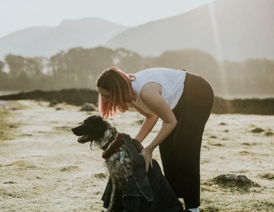 Woman with a dog on a farm