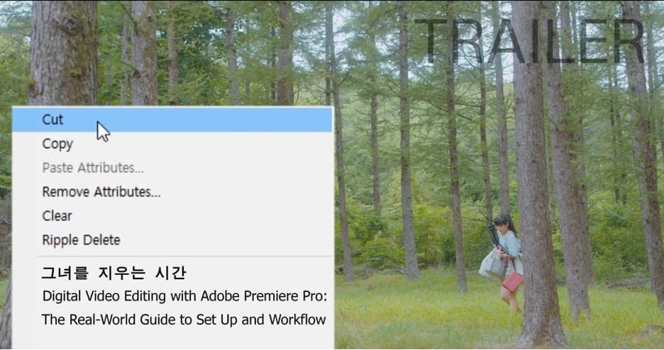 Screenshot of a woman walking through a forest while the right-click menu of a computer screen shows the title DIGITAL VIDEO EDITING WITH ADOBE PREMIERE PRO: THE REAL-WORLD GUIDE TO SET UP AND WORKFLOW