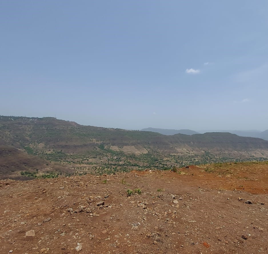 barren land and hill at a distant