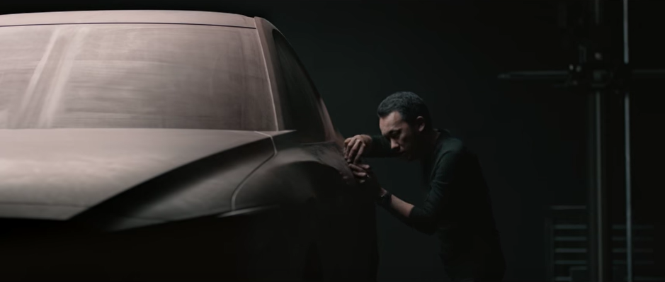 A man designs a car in a Mazda commercial.