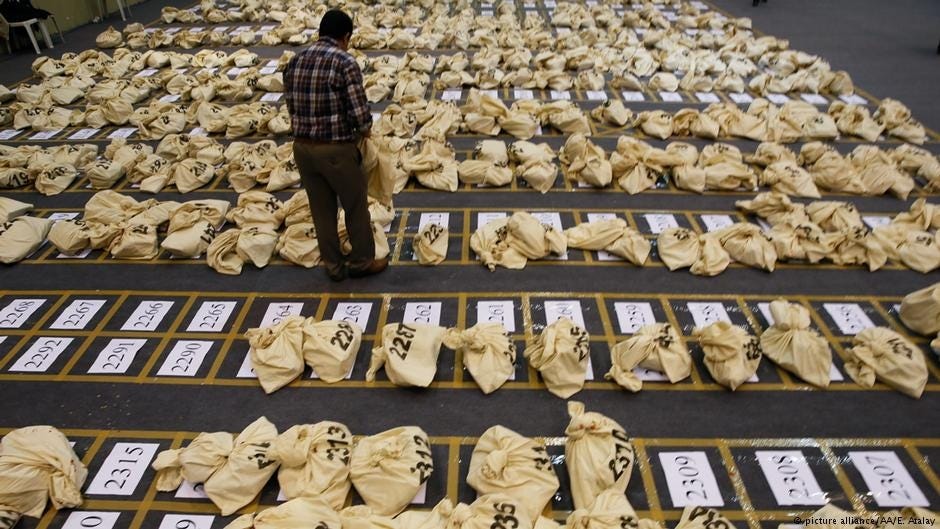 An election official observing the vote bags