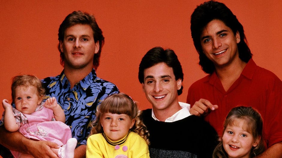 Early picture of the cast of full house on an orange background