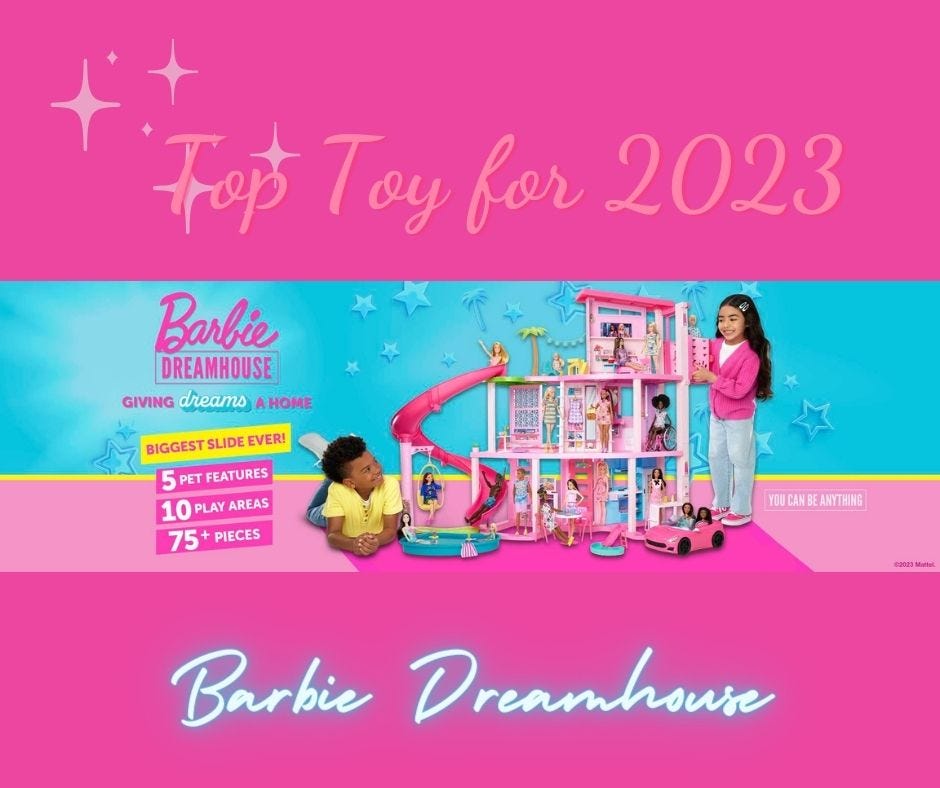 girls playing with a Barbie dreamhouse