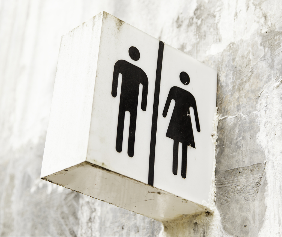 A sign indicating public men’s and women’s washrooms.