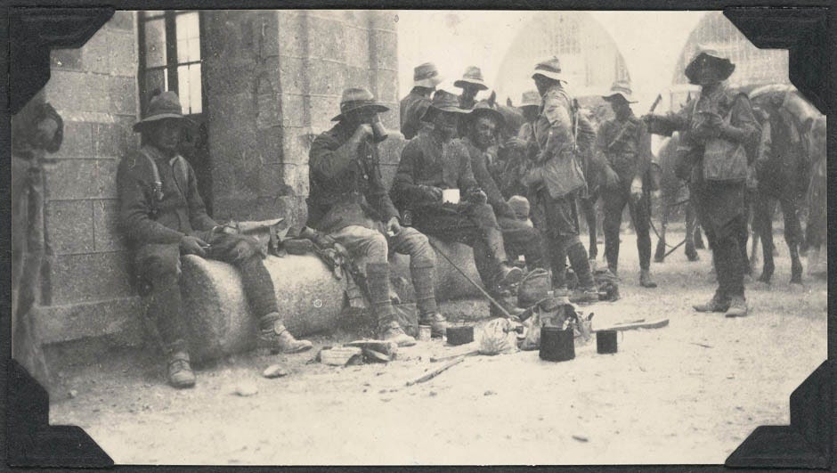 Troopers of the Wellington Mounted Rifles Regiment enjoy a hot drink after entering the city of Jaffa, 16 November 1917.