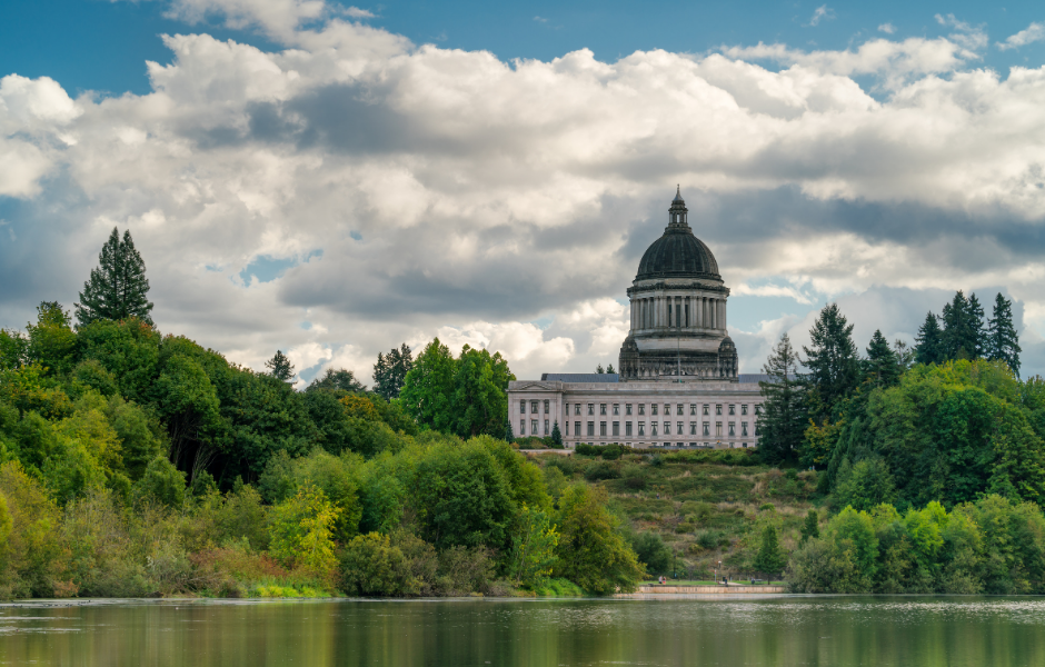 An image of the Washington State Capitol Building and Temple of Justice with Capital Lake in the foreground.