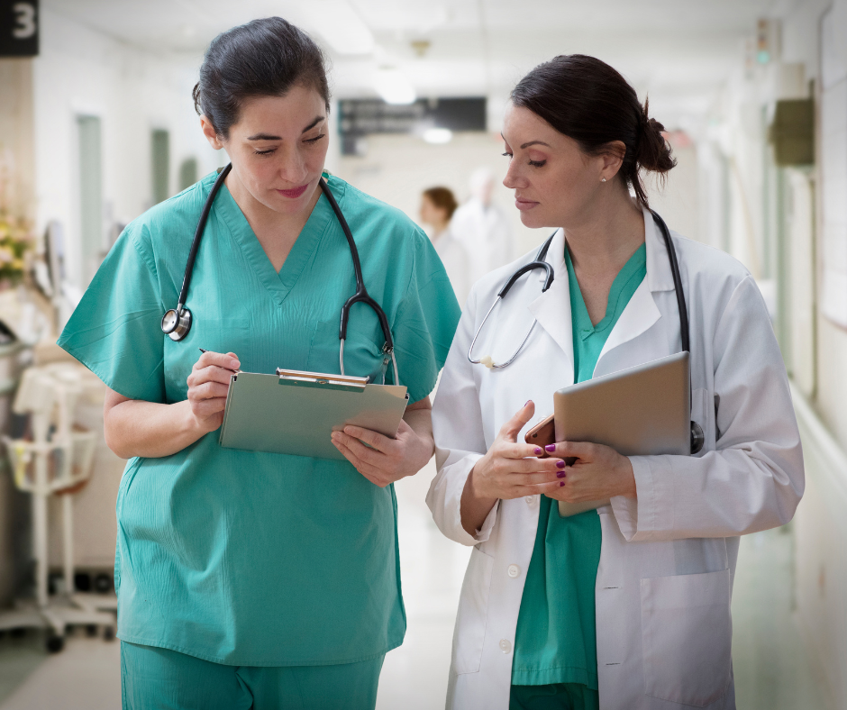 Two surgeons reviewing a preoperative checklist for safety