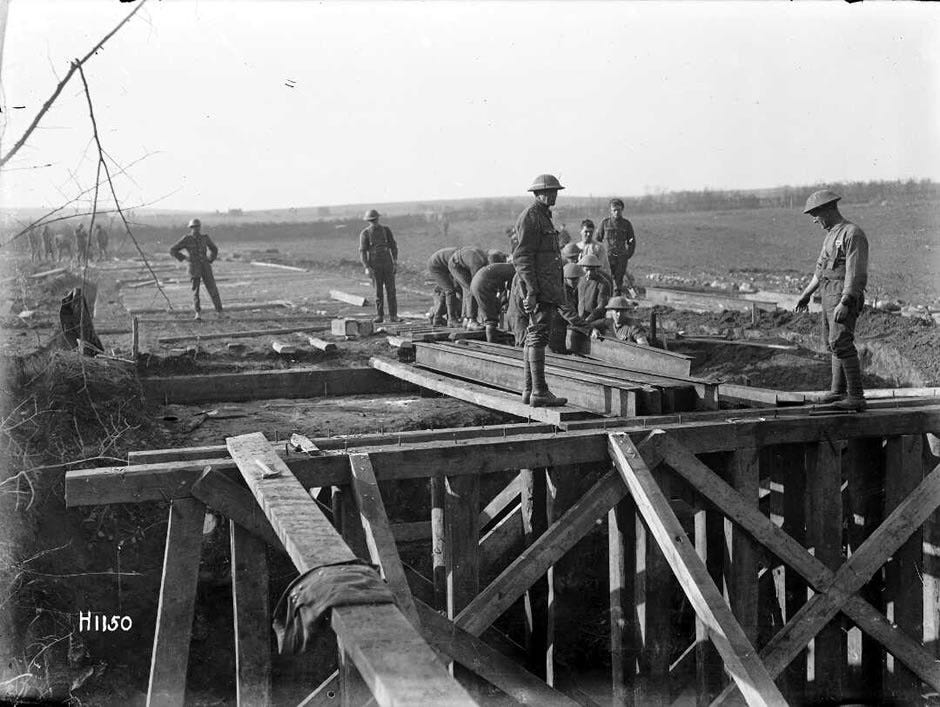 Members of the New Zealand Engineers (sappers) build a bridge on the Western Front, 28 October 1918. The bridge was to replace one blown up by the Germans in retreat.